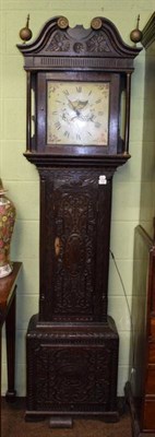 Lot 1168 - A 19th century thirty-hour carved oak longcase clock, painted white dial, later carved case