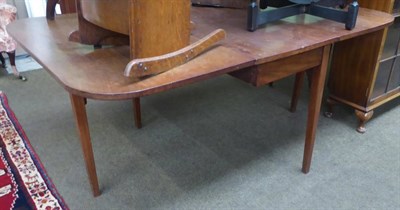 Lot 1191 - A 19th century mahogany drop leaf dining table