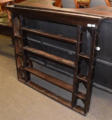 Lot 1201 - A 19th century stained pine wall rack