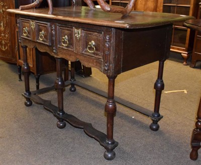 Lot 1204 - An 18th century and later oak two drawer side table