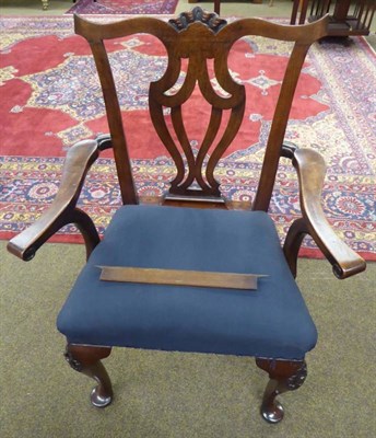 Lot 1220 - A mahogany open armchair with carved yoke crest rail