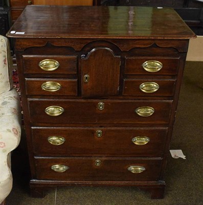 Lot 1225 - An oak chest of drawers
