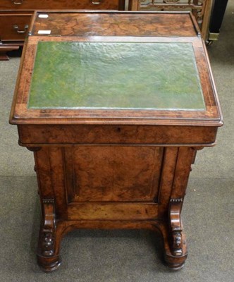 Lot 1234 - A Victorian walnut Davenport, lift lid with leather inset, fitted satinwood interior, four...