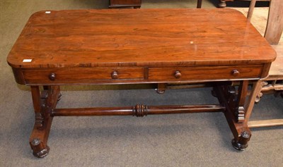 Lot 1239 - Early Victorian rosewood library table with two drawers raised on scrolled end supports