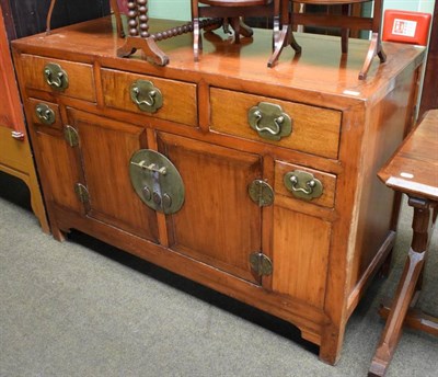 Lot 1249 - A Chinese style stained sideboard, with metal mounts
