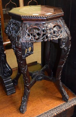 Lot 1252 - A Chinese padouk wood jardiniere stand
