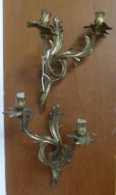 Lot 1272 - A pair of foliate gilt metal Rococo style two-branch wall sconces