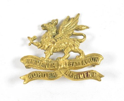 Lot 120 - A First World War Brass Cap Badge to the 11th (Lonsdale) Battalion Border Regiment, the reverse...