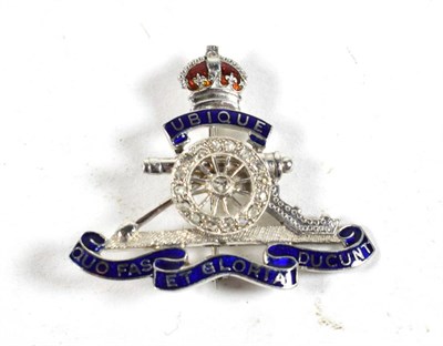 Lot 139 - An 18 Carat White Gold and Enamel Sweetheart Brooch to the Royal Artillery, the wheel set with...