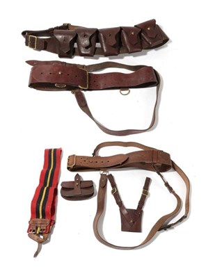 Lot 181 - Militaria, comprising a leather ammunition bandolier, two Sam Brownes, a pouch, a cross strap,...