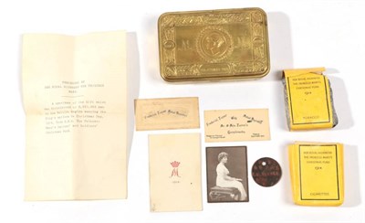 Lot 185 - A Princess Mary 1914 Christmas Tin, with contents comprising a packet of cigarettes, a packet...