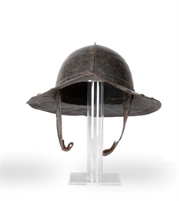 Lot 191 - An English Civil War Pikeman's Helmet, the two piece skull with folded raised medial ridge, the two