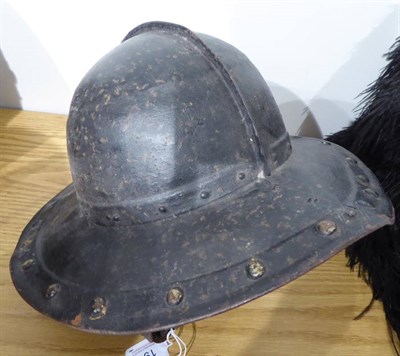 Lot 191 - An English Civil War Pikeman's Helmet, the two piece skull with folded raised medial ridge, the two