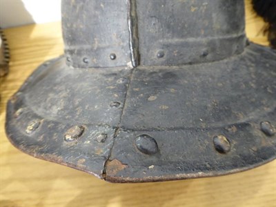 Lot 191 - An English Civil War Pikeman's Helmet, the two piece skull with folded raised medial ridge, the two