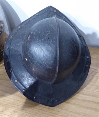 Lot 191 - An English Civil War Pikeman's Helmet, the two piece skull with folded raised medial ridge, the two
