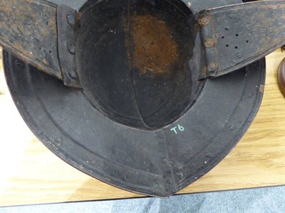 Lot 191 - An English Civil War Pikeman's Helmet, the two piece skull with folded raised medial ridge, the two