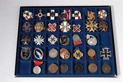 Lot 202 - A Collection of Thirty Three German Medals and Award Badges, mainly copies, in a glazed display...