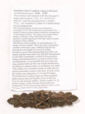 Lot 208 - A German Close Combat Clasp in Bronze, the reverse with wide horizontal flat pin, magnetic...