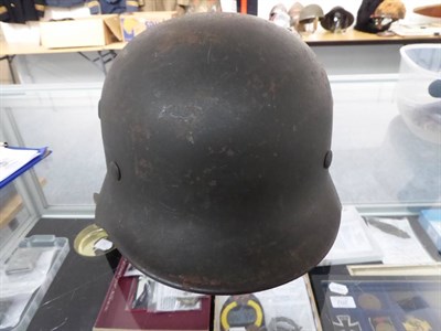 Lot 217 - A German Third Reich M35 Police Double Decal Helmet, with dark green finish, police and party...