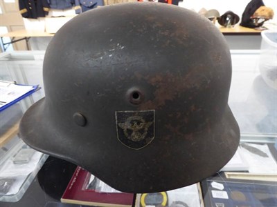 Lot 217 - A German Third Reich M35 Police Double Decal Helmet, with dark green finish, police and party...
