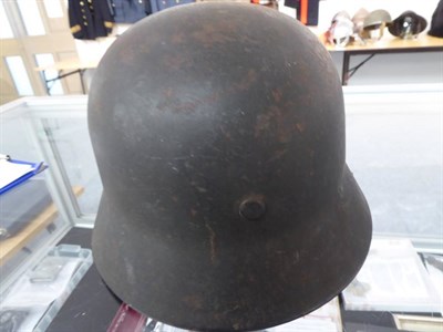 Lot 217 - A German Third Reich M35 Police Double Decal Helmet, with dark green finish, police and party...