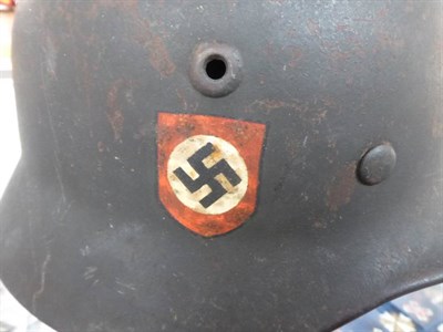 Lot 217 - A German Third Reich M35 Police Double Decal Helmet, with dark green finish, police and party...