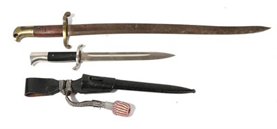 Lot 219 - A German Third Reich Police Parade Dagger, with unmarked single edge plated blade, plated recurving