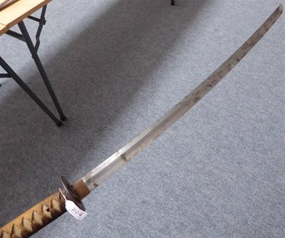 Lot 224 - A Japanese Shinto Katana, the 69cm steel blade with faint undulating hamon, one piece copper habaki