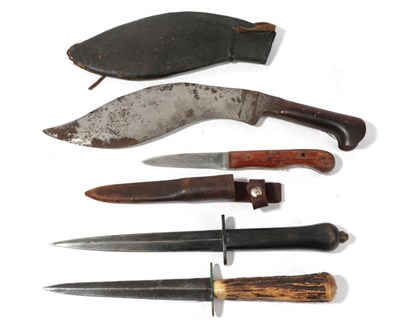 Lot 263 - A Kukri Type Fighting Knife, the 24cm broad single edge curved steel blade single edge for the last