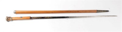 Lot 280 - A 19th Century Malacca Swordstick, the 67.5cm single edge fullered steel blade half blued, engraved