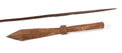 Lot 288 - An Early 20th Century Samoan Sword Club, of honey coloured light wood, carved with bands of...