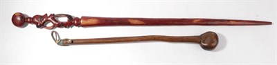 Lot 289 - A Zulu Knobkerrie, of dense hard wood, the compressed globular head with natural depressions,...