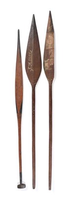 Lot 293 - A Solomon Islands Paddle Club, with pointed leaf shape head decorated with stylised figures in...