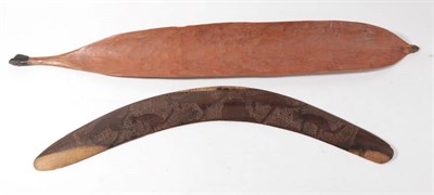 Lot 294 - An Australian Aborigine Woomera, pre-1940, of curved light orange stained wood, one side with...