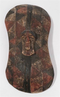 Lot 319 - A Songye Wood Shield, DRC, carved from a single piece of wood, of waisted and convex oblong...