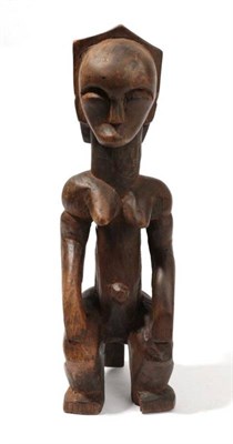 Lot 326 - A Fang, Gabon Carved Wood Fertility Figure, as a seated woman with pendulous breasts, her hands...