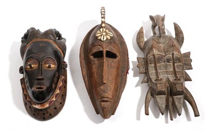 Lot 338 - A Senufo Kpeli-Yehe Double Faced Mask, with hornbill headdress, the faces with hobnail type...