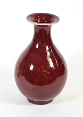 Lot 12 - A Chinese sang de boeuf bottle vase with everted rim, 33.5cm high