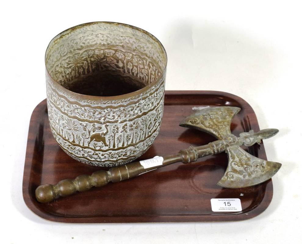 Lot 15 - An Indian brass plant pot holder; and a German brass decorative axe