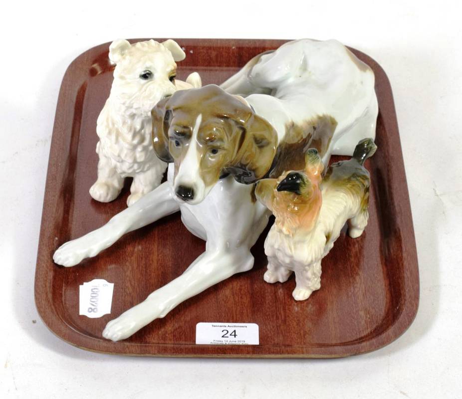 Lot 24 - Karl Ens porcelain models comprising recumbent hound and two terriers (3)