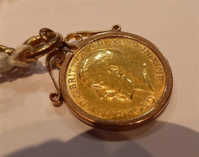 Lot 56 - A double Albert curb link watch chain, each link stamped '375', with attached full gold...
