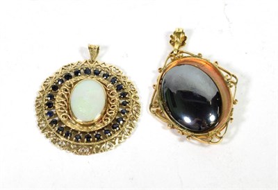 Lot 71 - A 9 carat gold pendant with floral motif, measures 5.5cm by 3.6cm; and a 9 carat gold opal and...