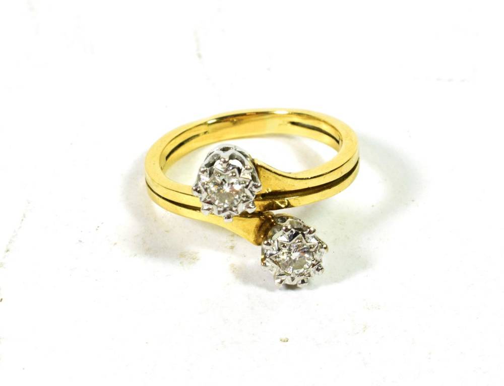 Lot 75 - A diamond two stone twist ring, finger size N