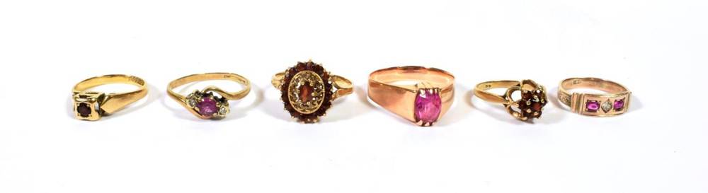 Lot 92 - Two 9 carat gold garnet set rings, finger sizes I1/2 and O1/2; a garnet cluster ring, marks rubbed