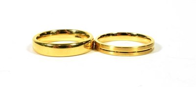 Lot 101 - Two 18 carat gold band rings, finger sizes L and M (2)