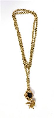 Lot 102 - A garnet and cultured pearl pendant on a 9 carat gold watch chain, chain length 72cm
