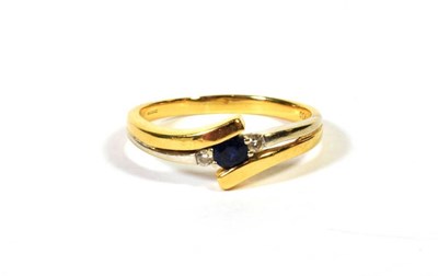 Lot 109 - An 18 carat gold sapphire and diamond two colour twist ring, finger size Q1/2