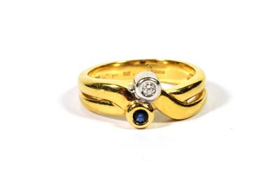 Lot 110 - An 18 carat gold sapphire and diamond ring, finger size N1/2