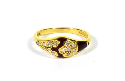 Lot 112 - An 18 carat gold diamond and red enamel ring, finger size L