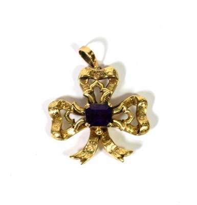 Lot 113 - An amethyst set bow motif, later adapted as a pendant, with locket panel to the reverse,...